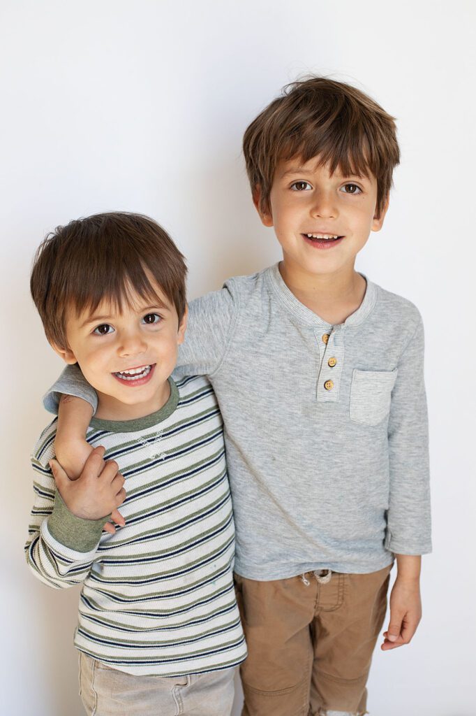 brothers smiling at annapolis preschool photographer