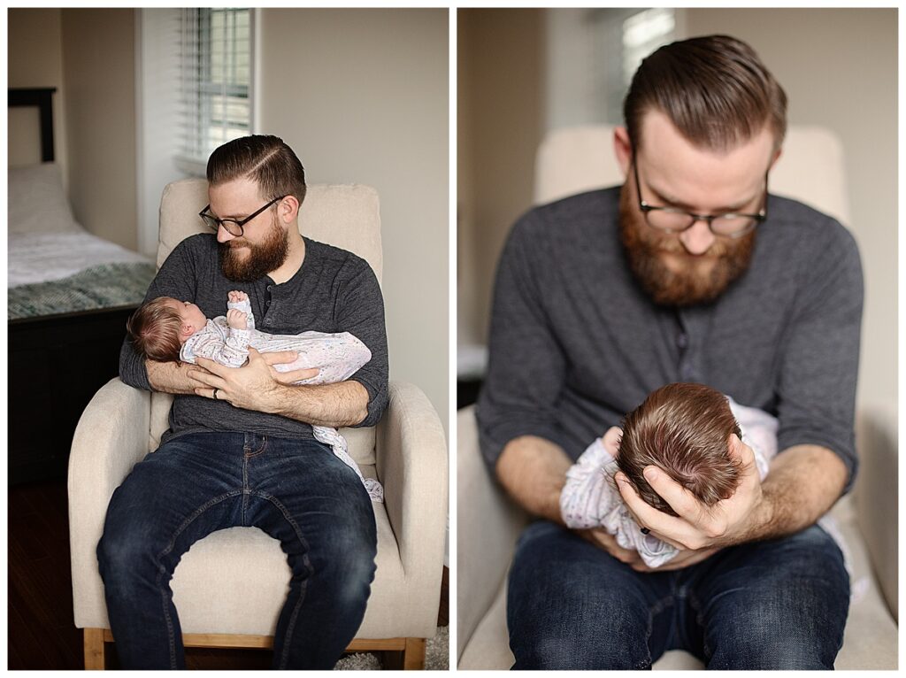 dad holding newborn daughter during in home photo session baltimore
