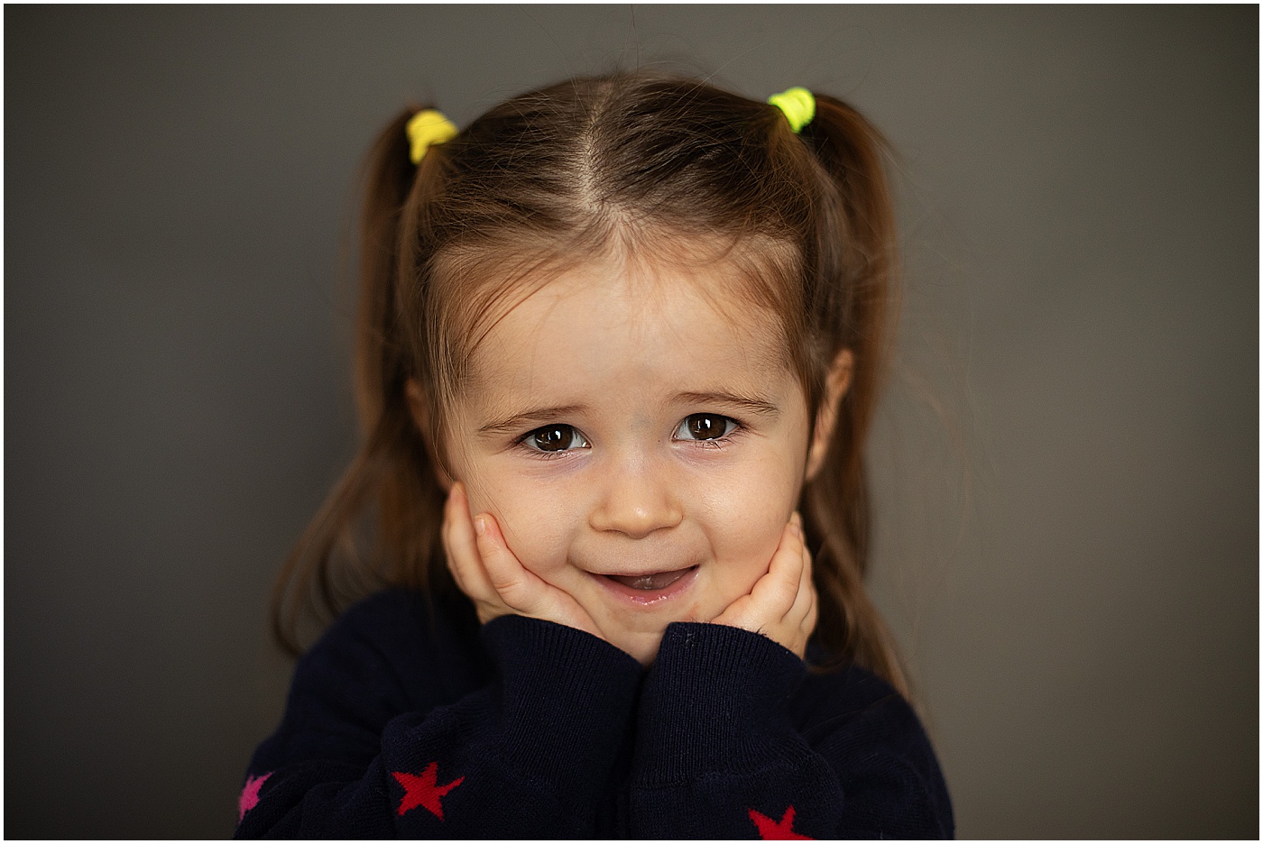 preschool student making funny face at camera school picture day