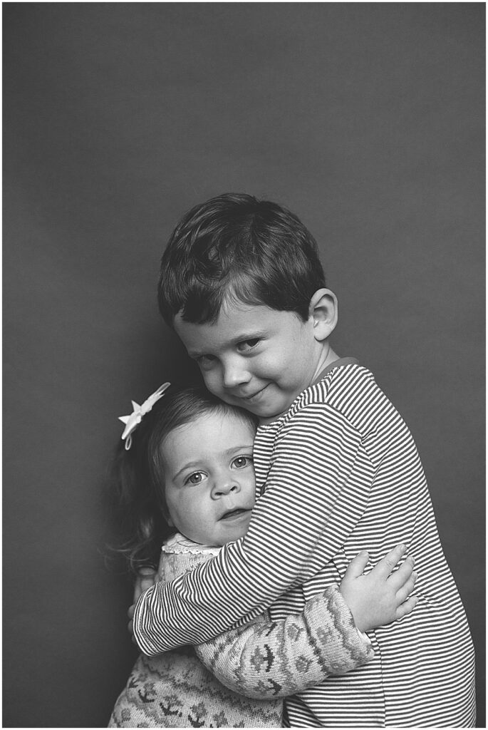 brother and sister hugging for school picture day