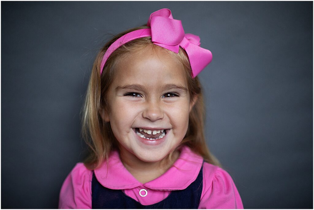 pre-k student laughing at camera during school picture day