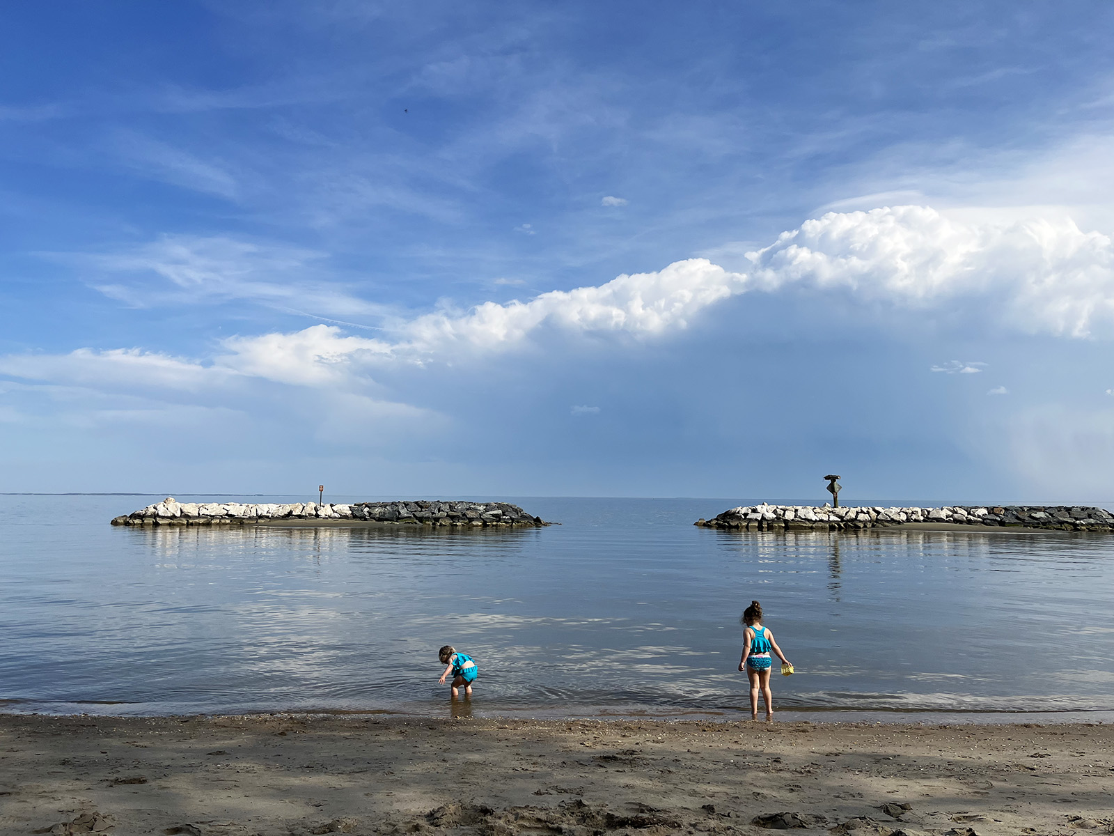 two girls playing at a local baltimore beach
