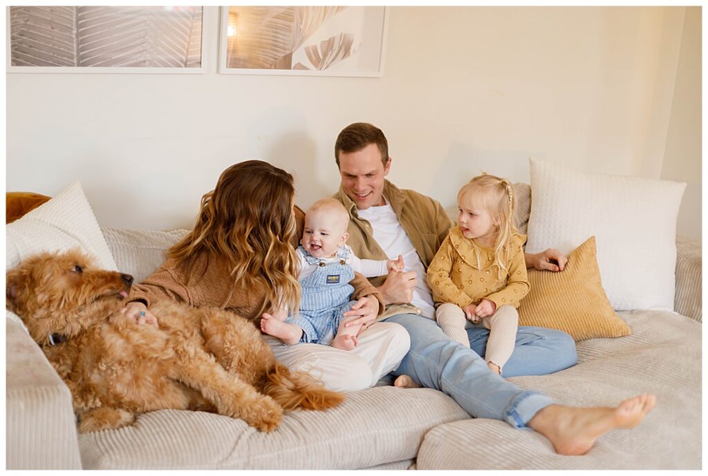 family smiling during in home photo sessions Baltimore