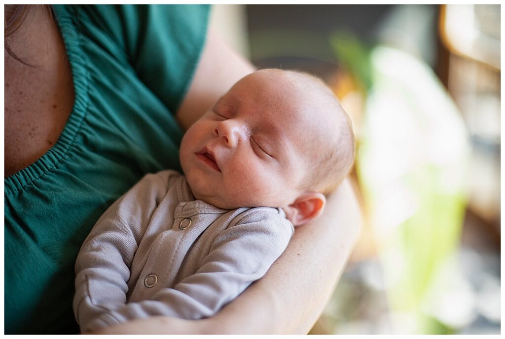 close up of mom holding son for family photos