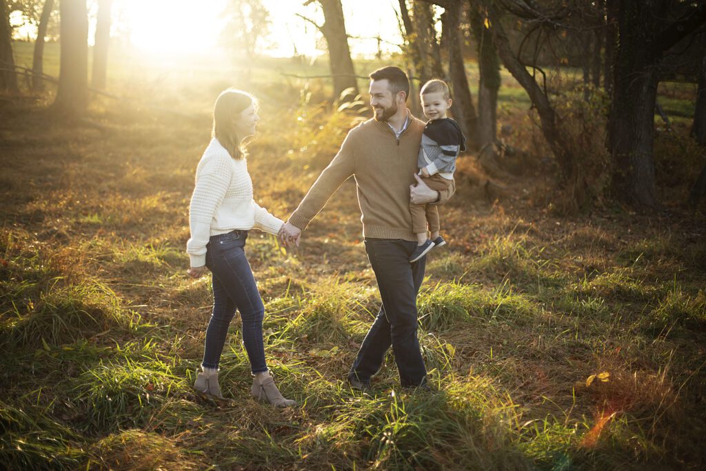 Family walking during family photo session in Baltimore