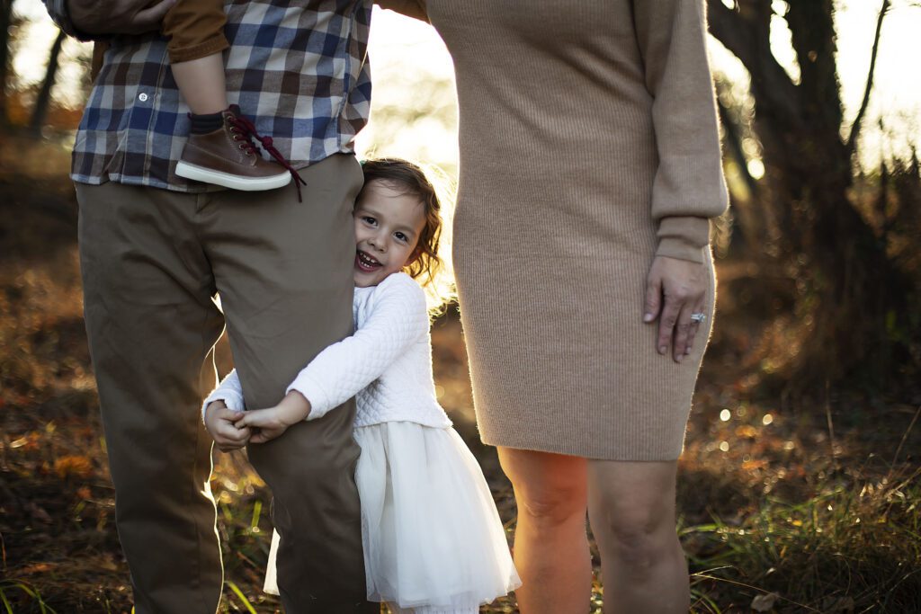 Girl laughing during family photo session in Baltimore