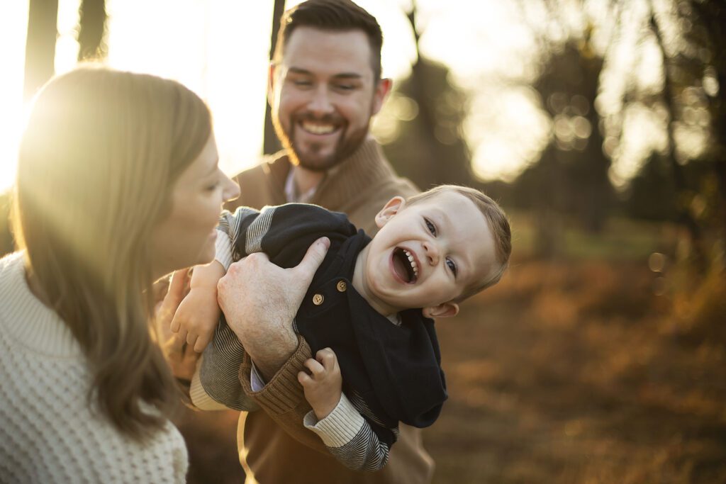 Toddler laughing during family photo session in Baltimore