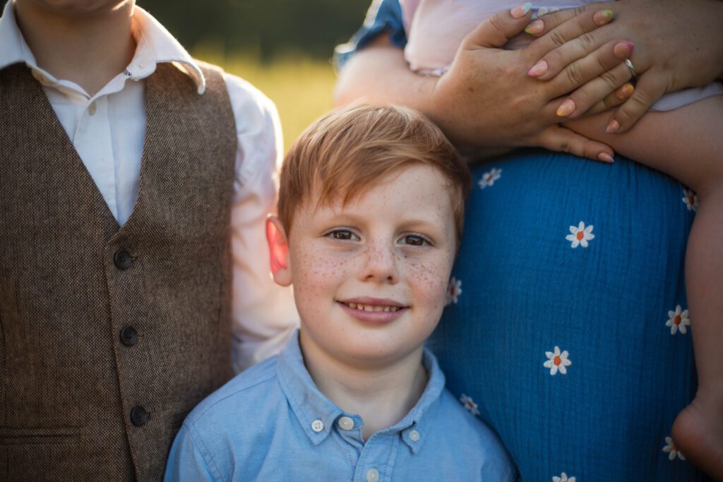 boy smiling at camera during baltimore family photo session
